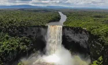 The majestic Kaieteur Falls in Guyana, with water cascading into the gorge below.